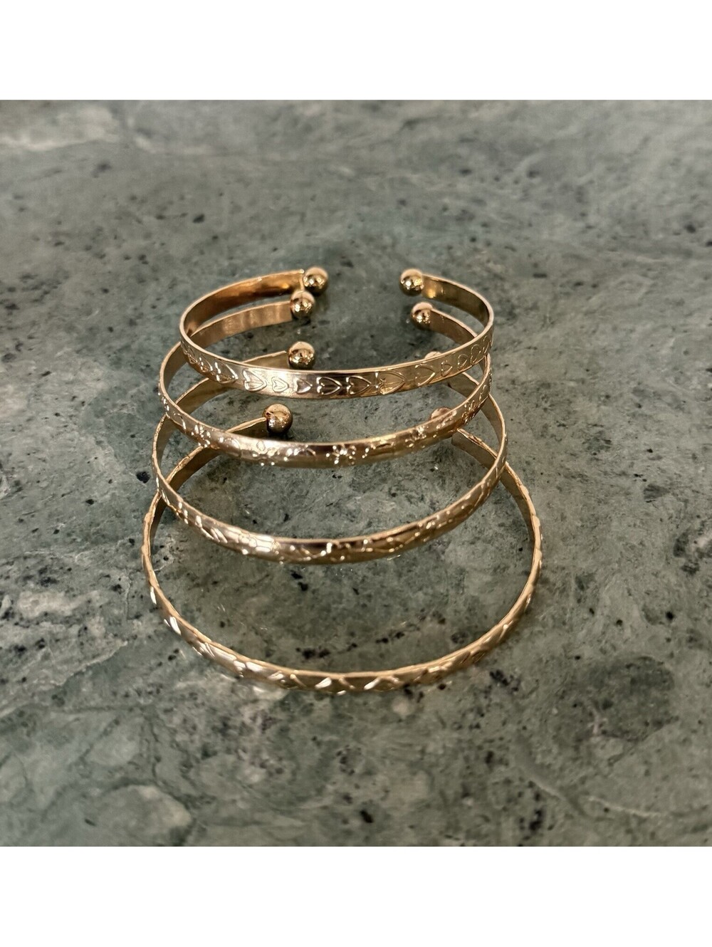 Set of Four Gold Costume Bracelets Bangles